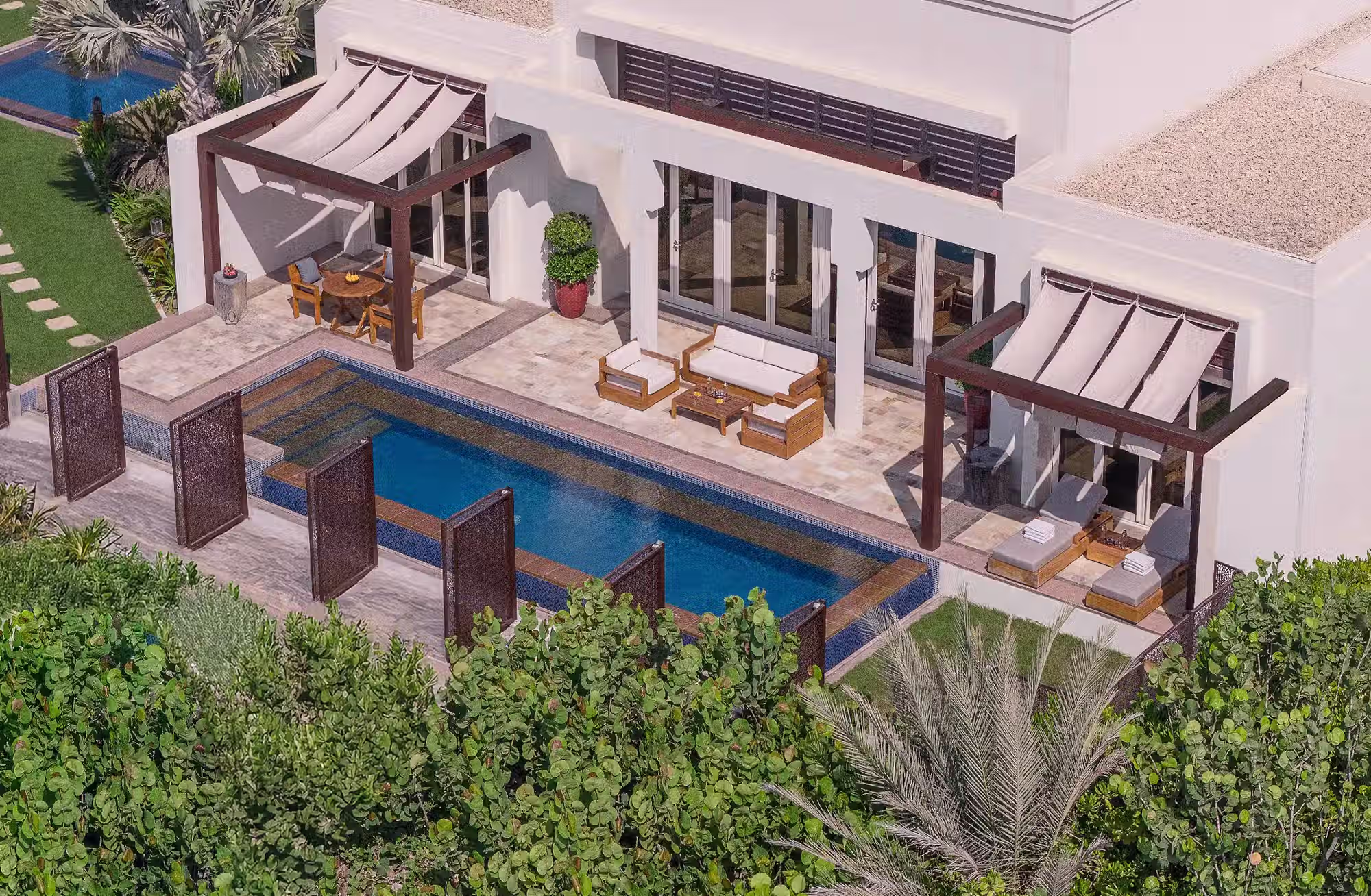 306 camere, suite e ville che cambiano prospettiva tra giardini, golf e Golfo Arabico, fino alla privacy della propria piscina. — immagine 3